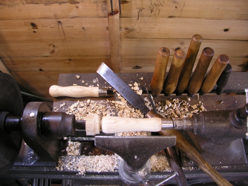 Turning a trowel handle on a treadle lathe